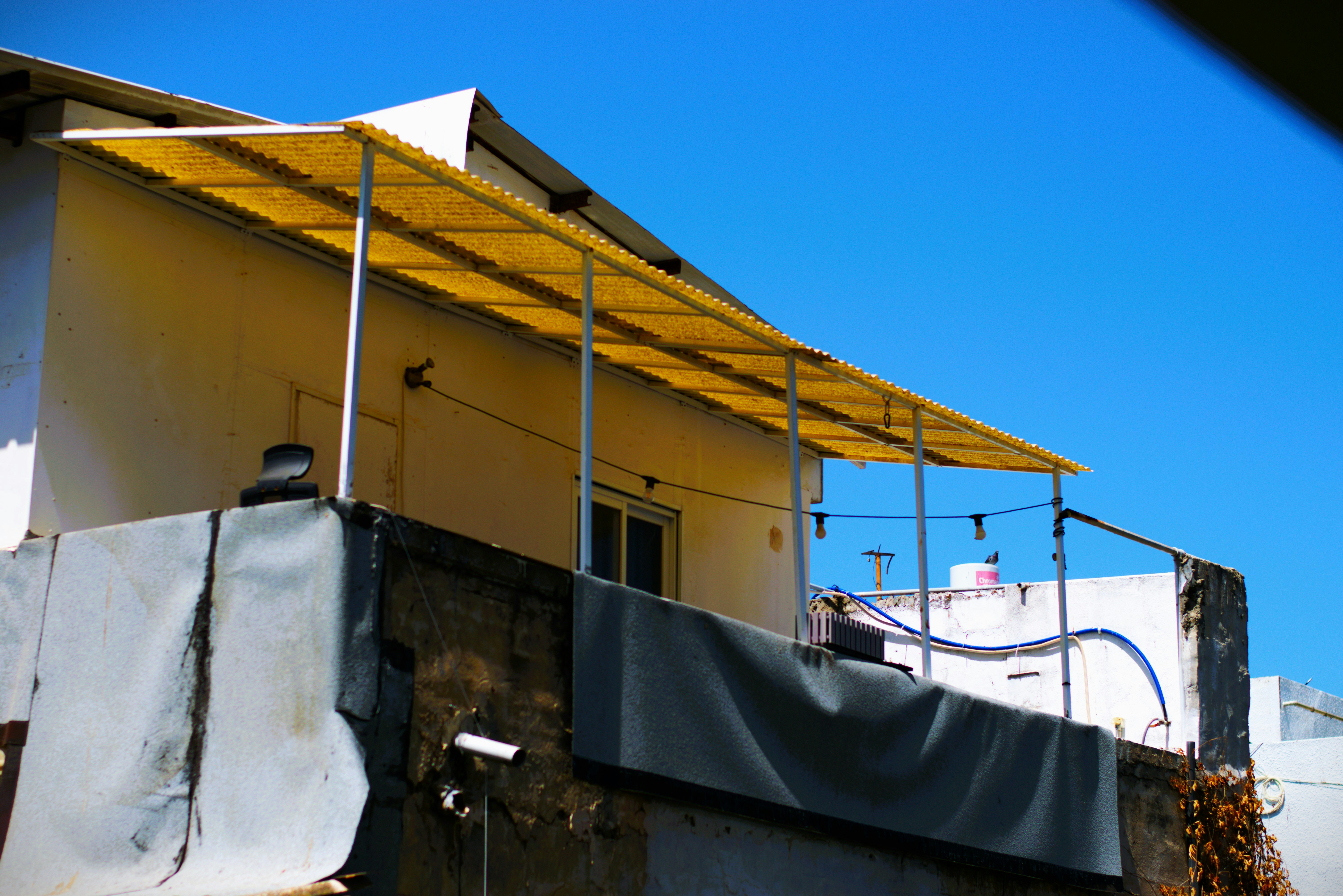 a building with a yellow awning on top of it
