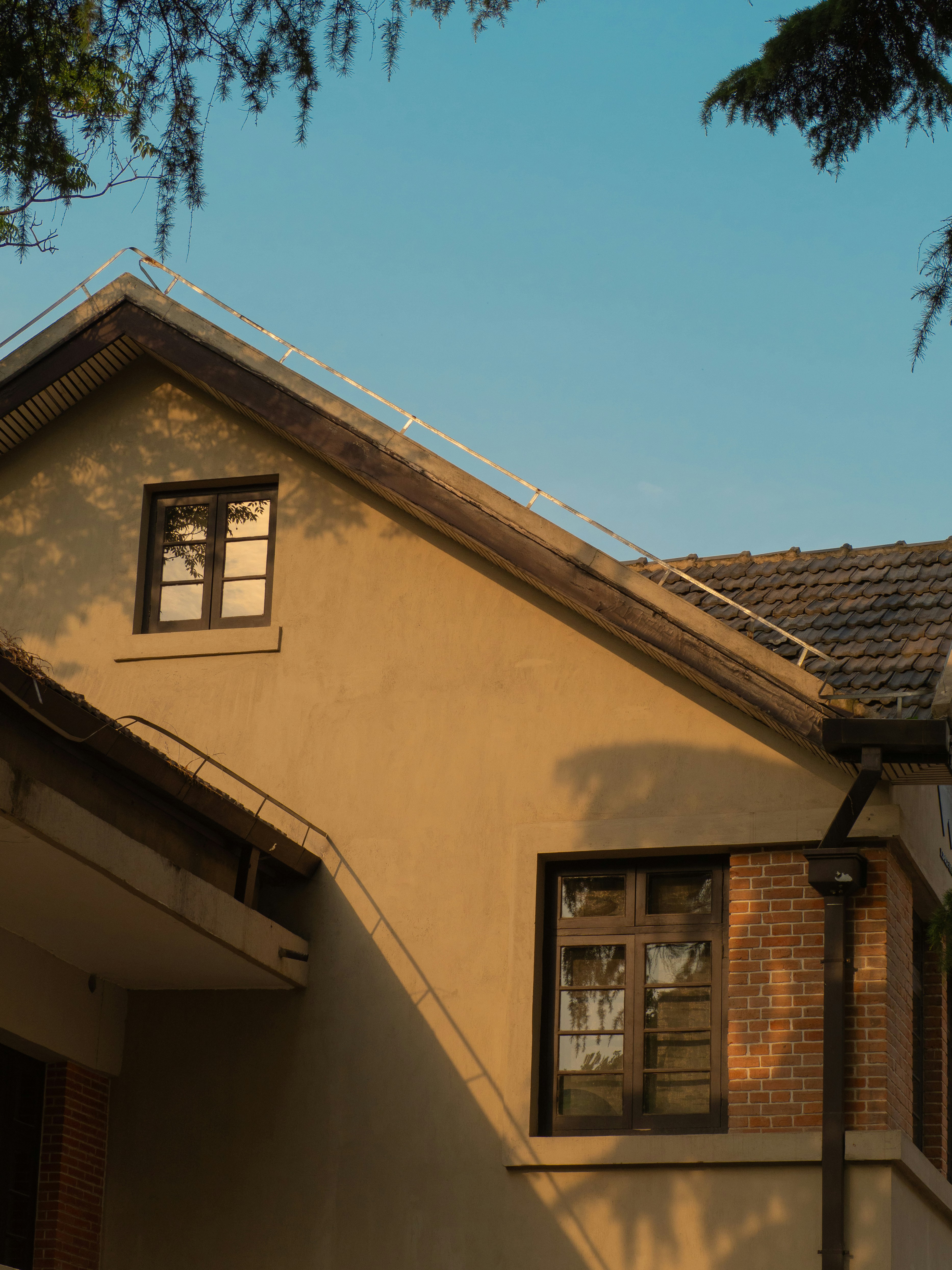 a house with a clock on the front of it