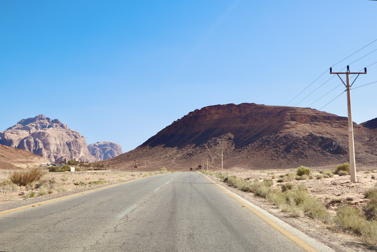 A paved road leading toward Wadi Rum in southern Jordan