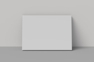 A white square object on a gray surface