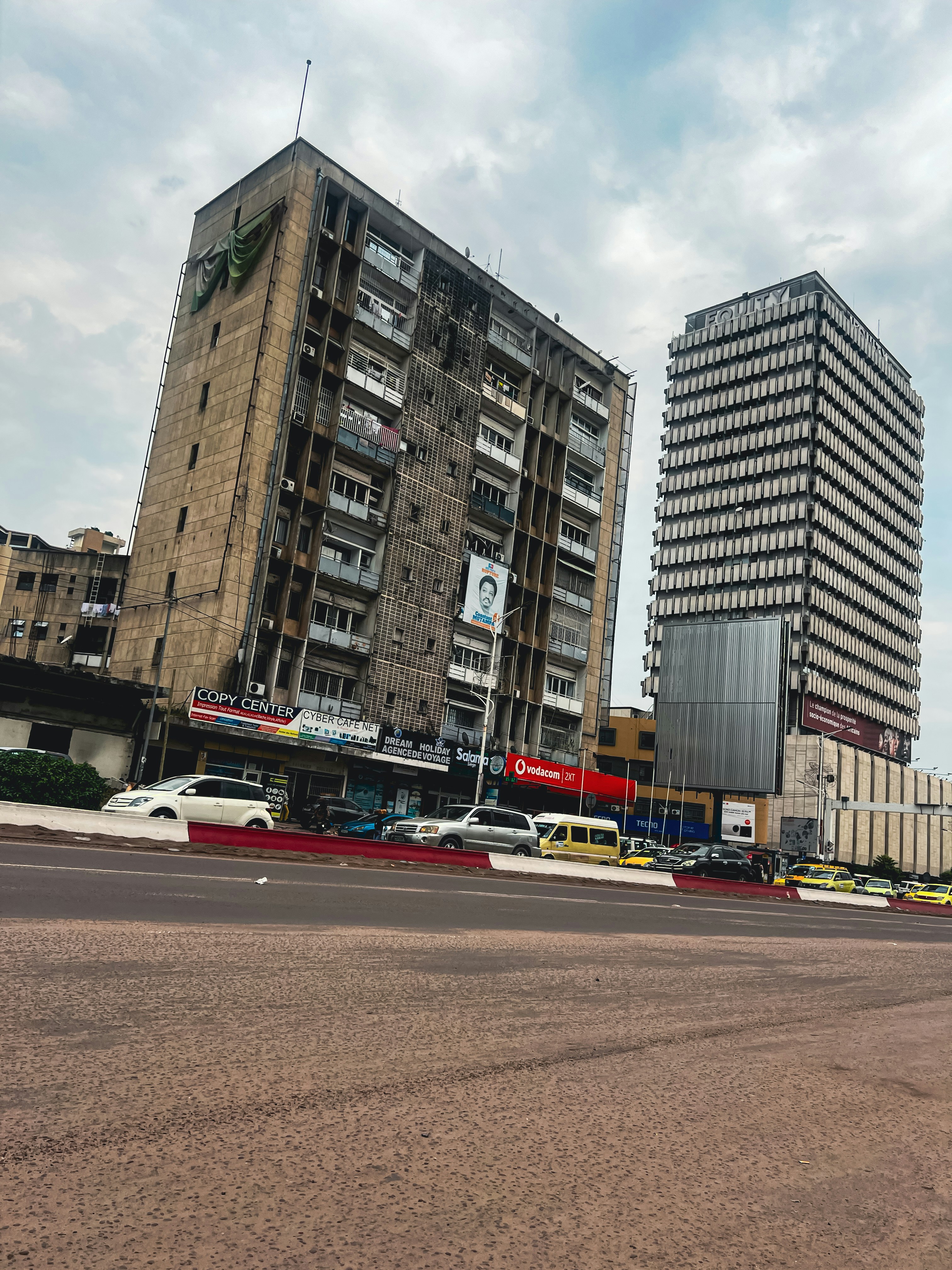 a very tall building sitting next to a very tall building