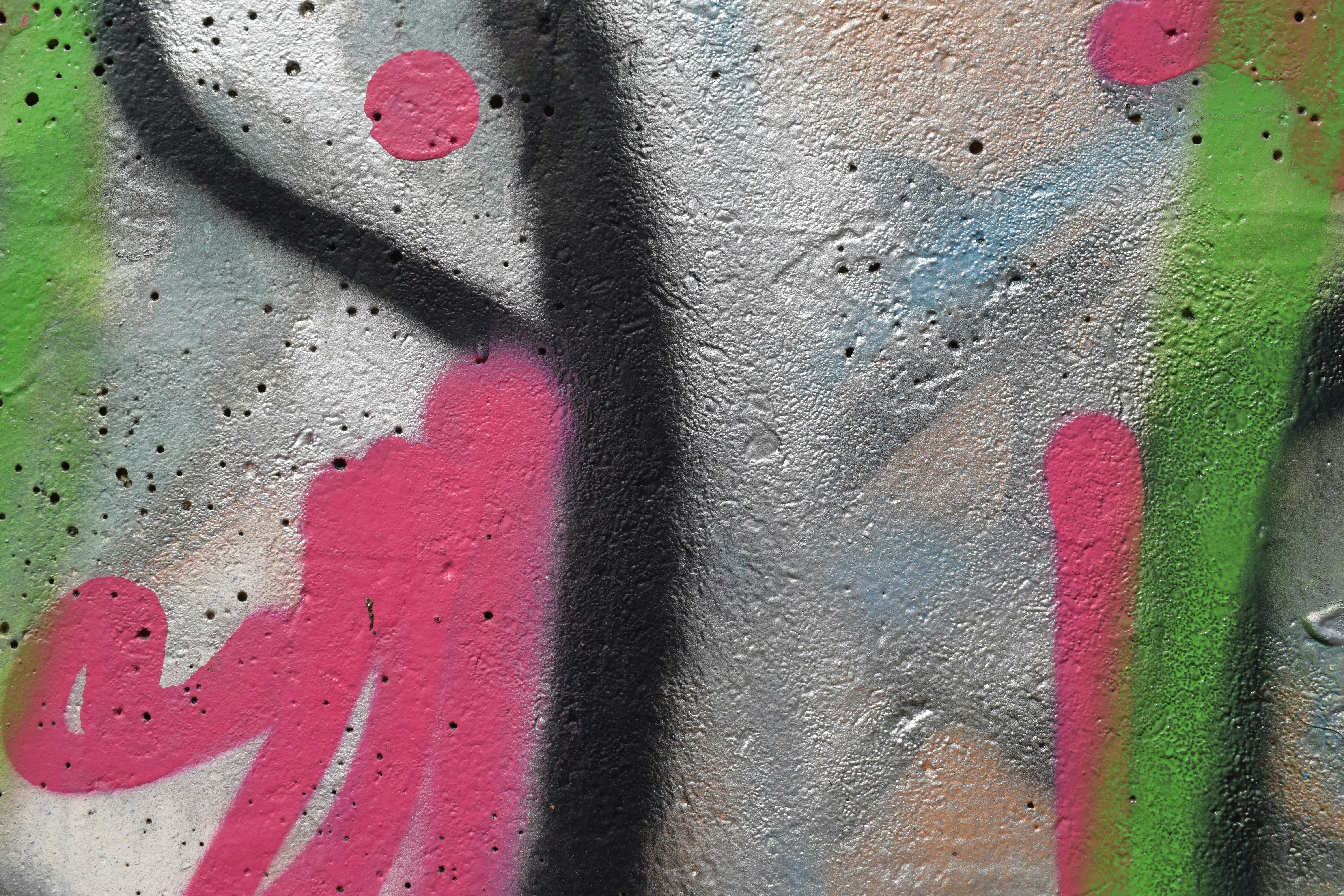 a close up of a wall with graffiti on it, 