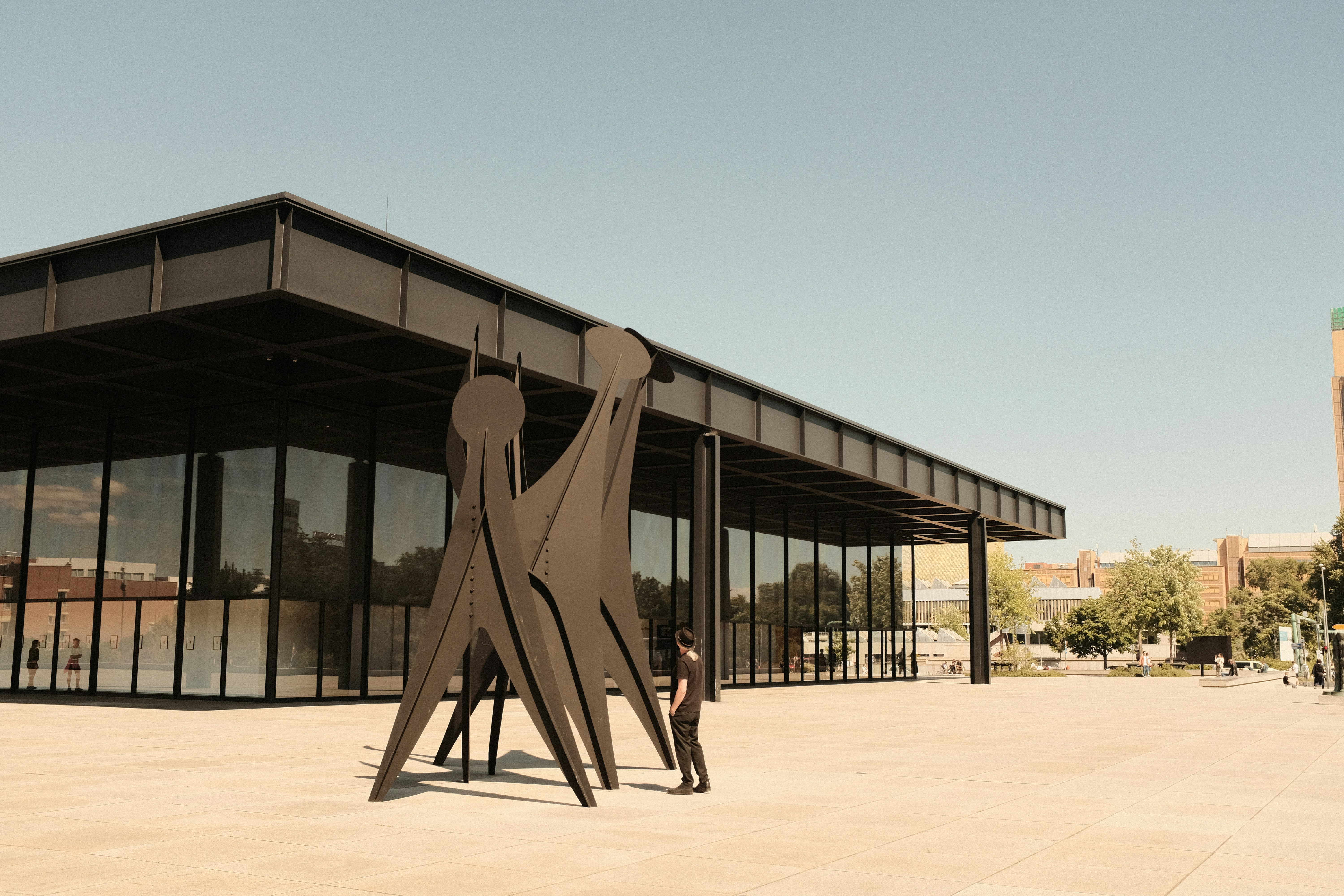 a sculpture of a man and a woman in front of a building