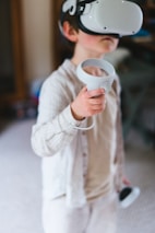 a young boy wearing a virtual reality headset