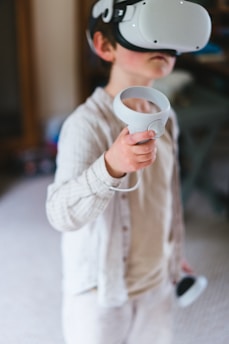 a young boy wearing a virtual reality headset