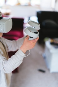 a woman holding a remote control in her hands