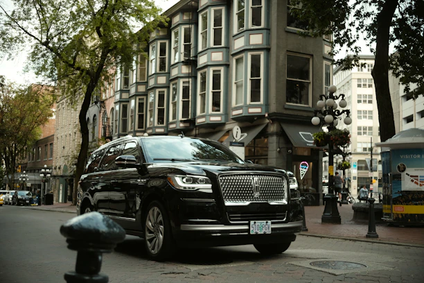 a black car parked on the side of the road