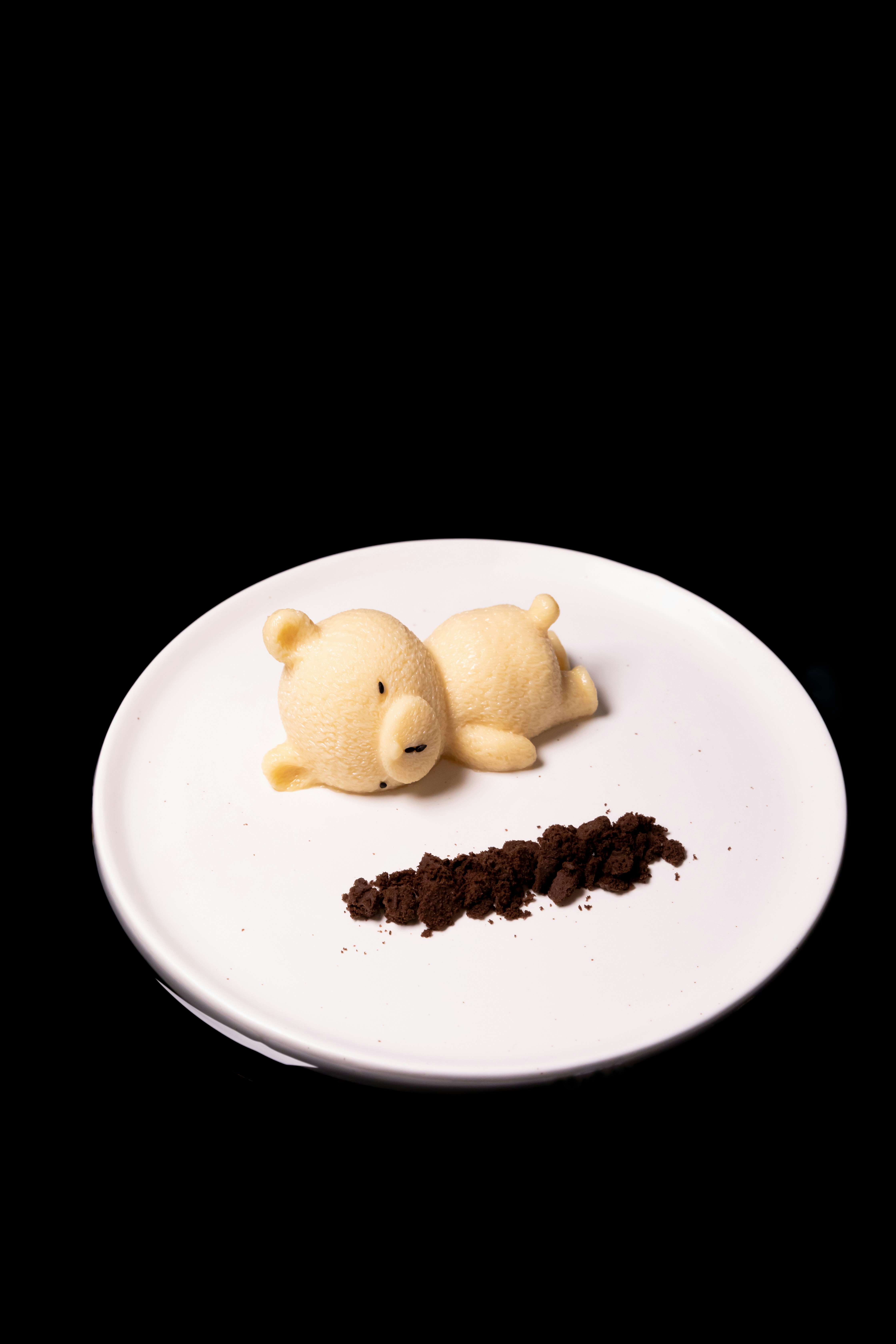 a white plate topped with a piece of cake