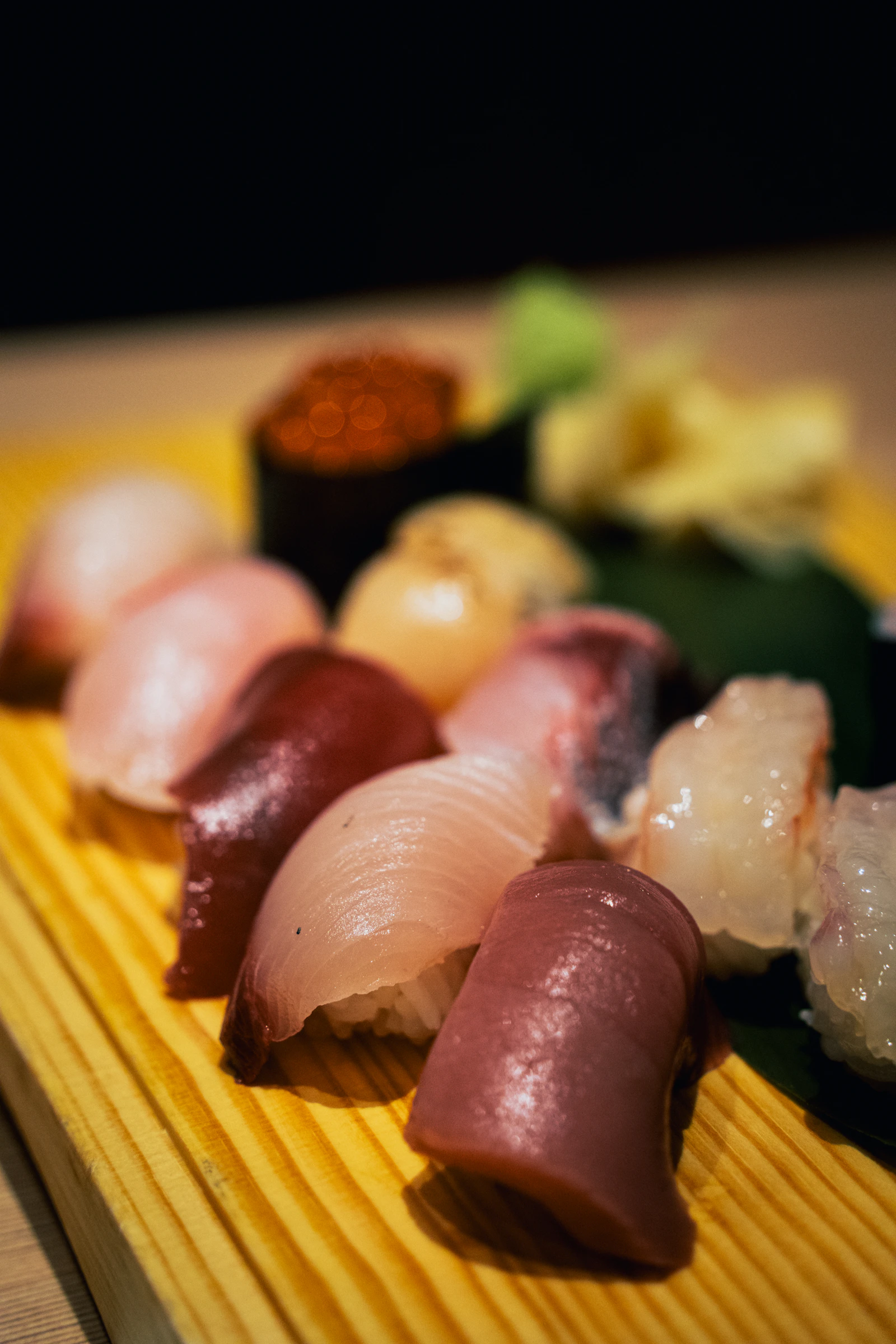 A course of nigiri, closely plated