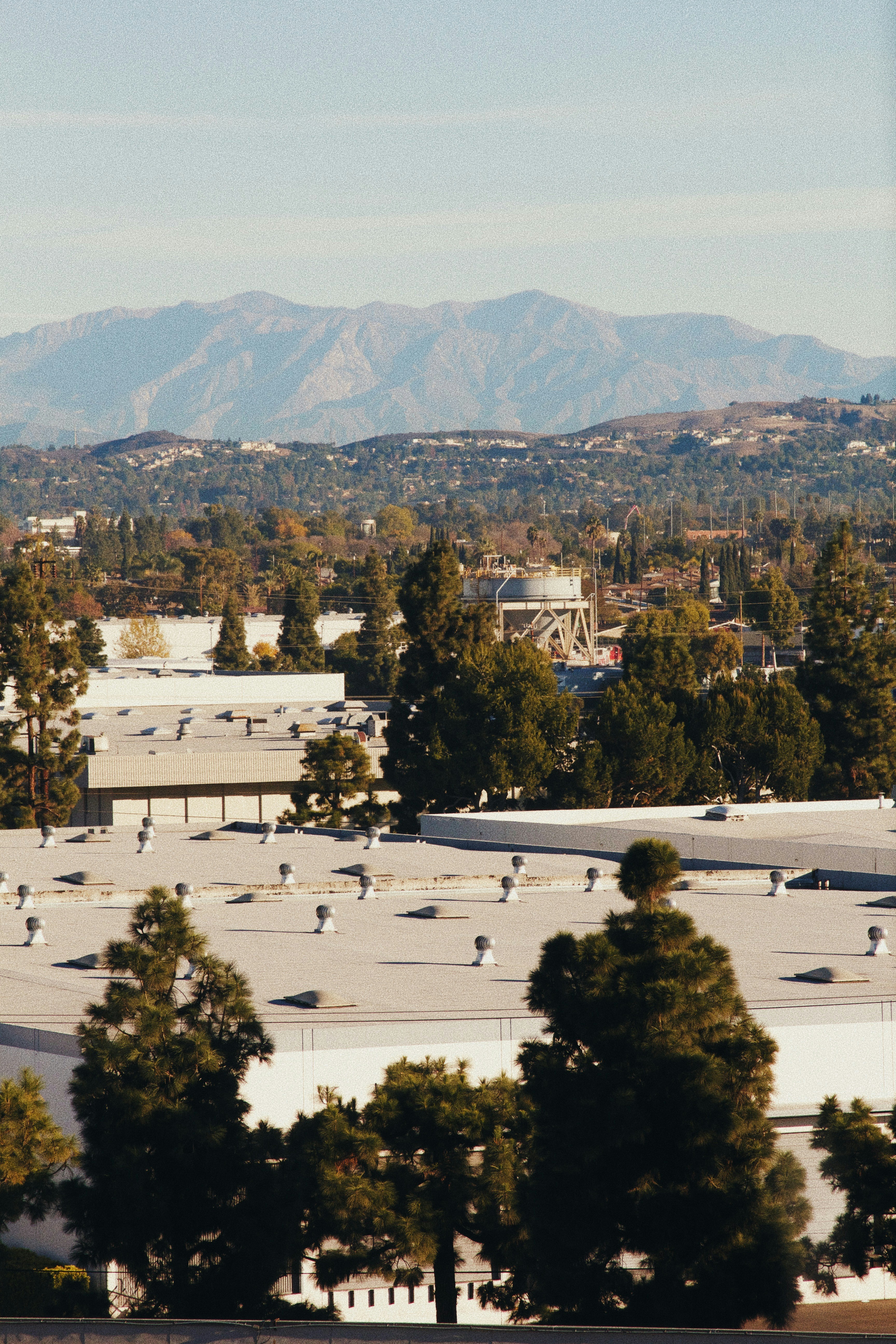a view of a city with mountains in the background