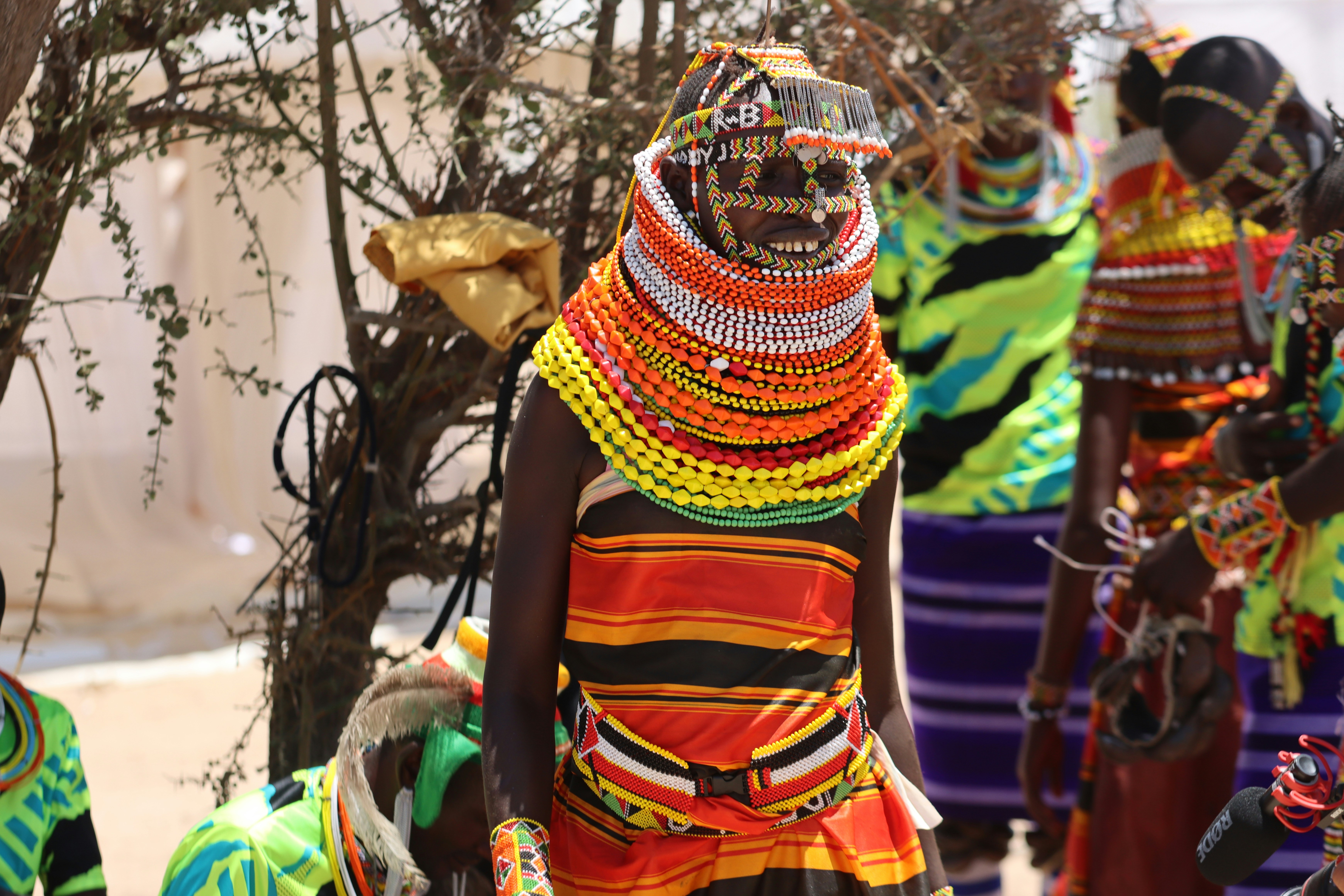 a group of women dressed in brightly colored clothing