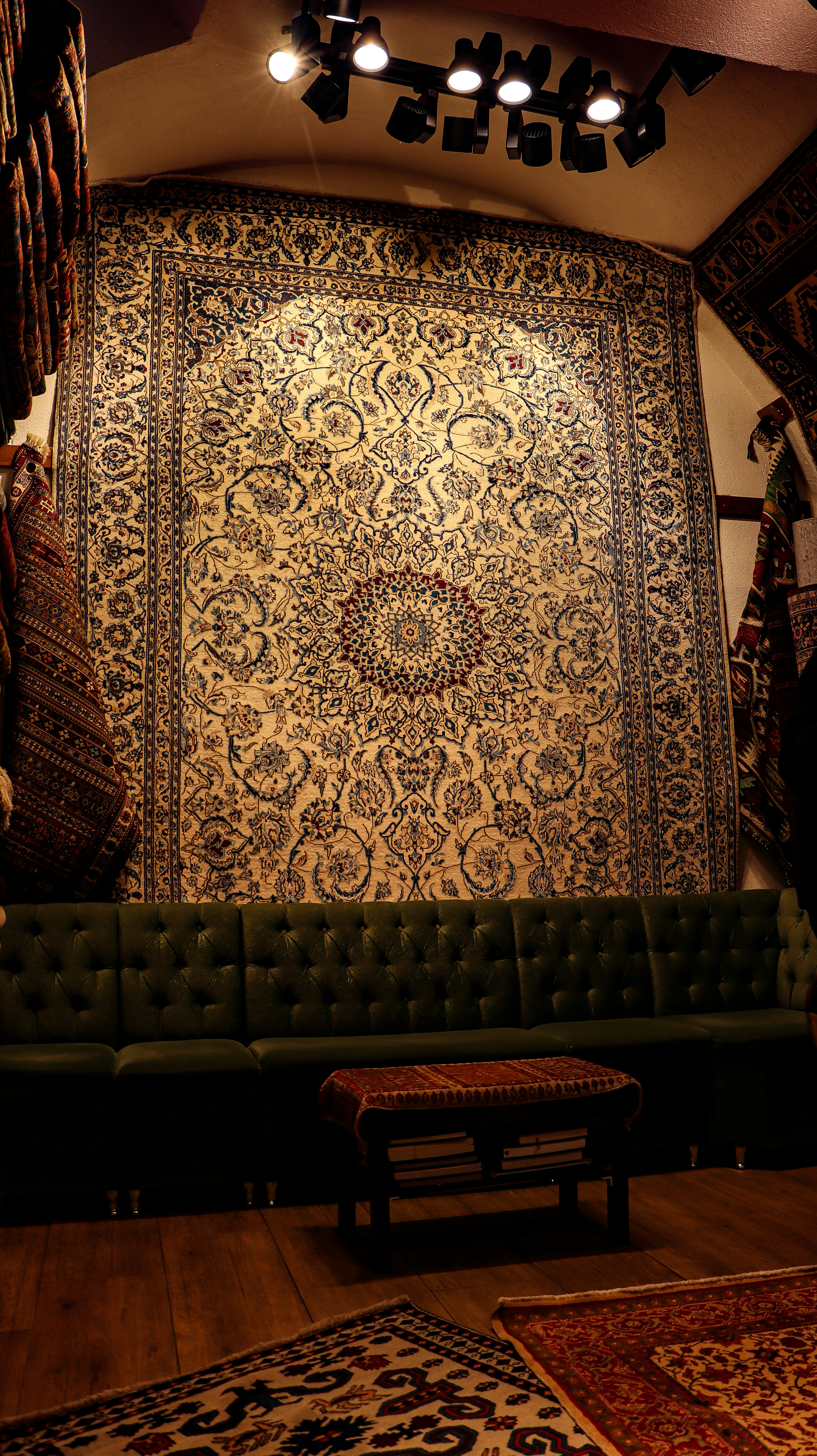 a living room with a couch and rugs