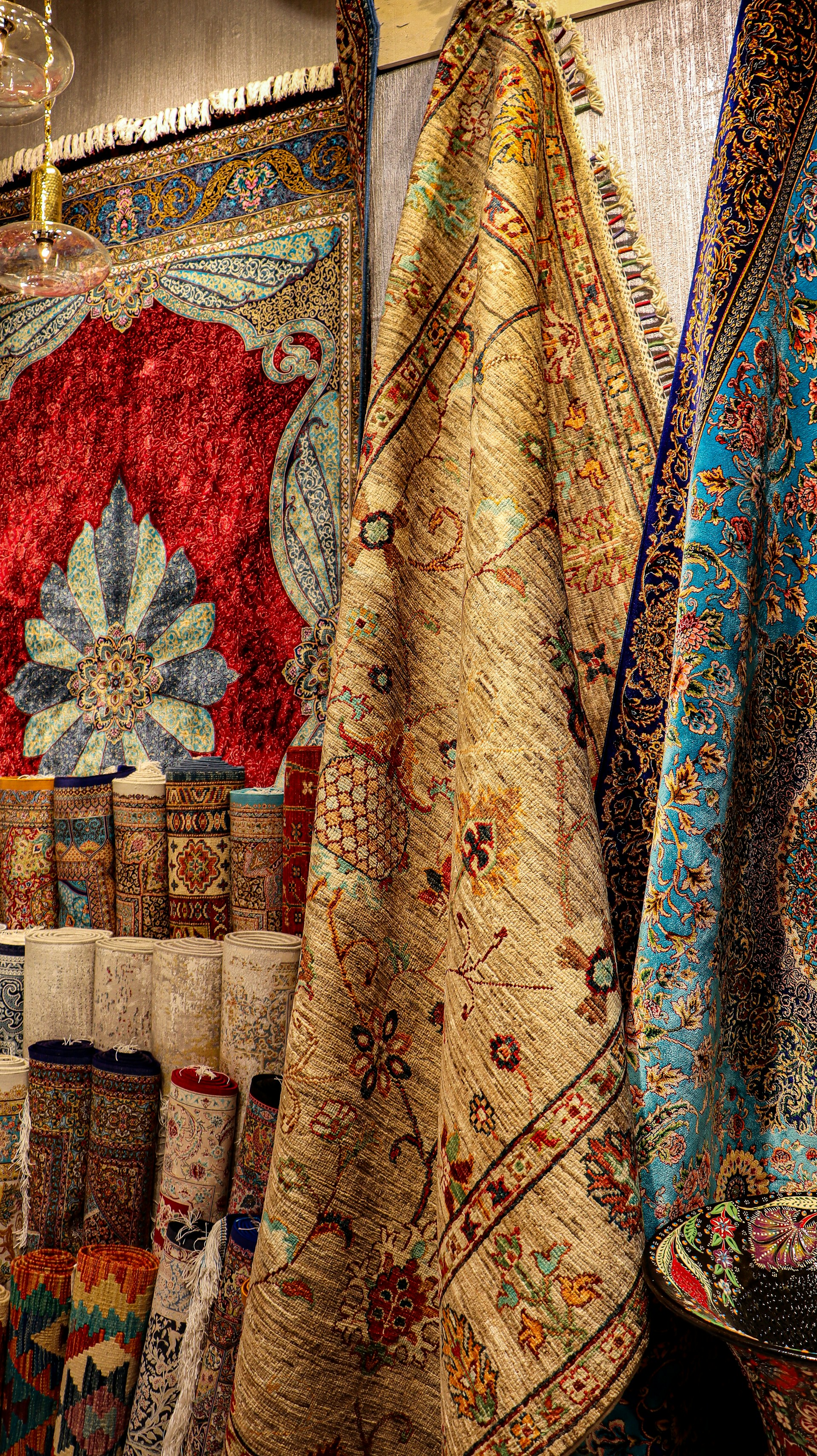 a display of rugs and rugs in a store
