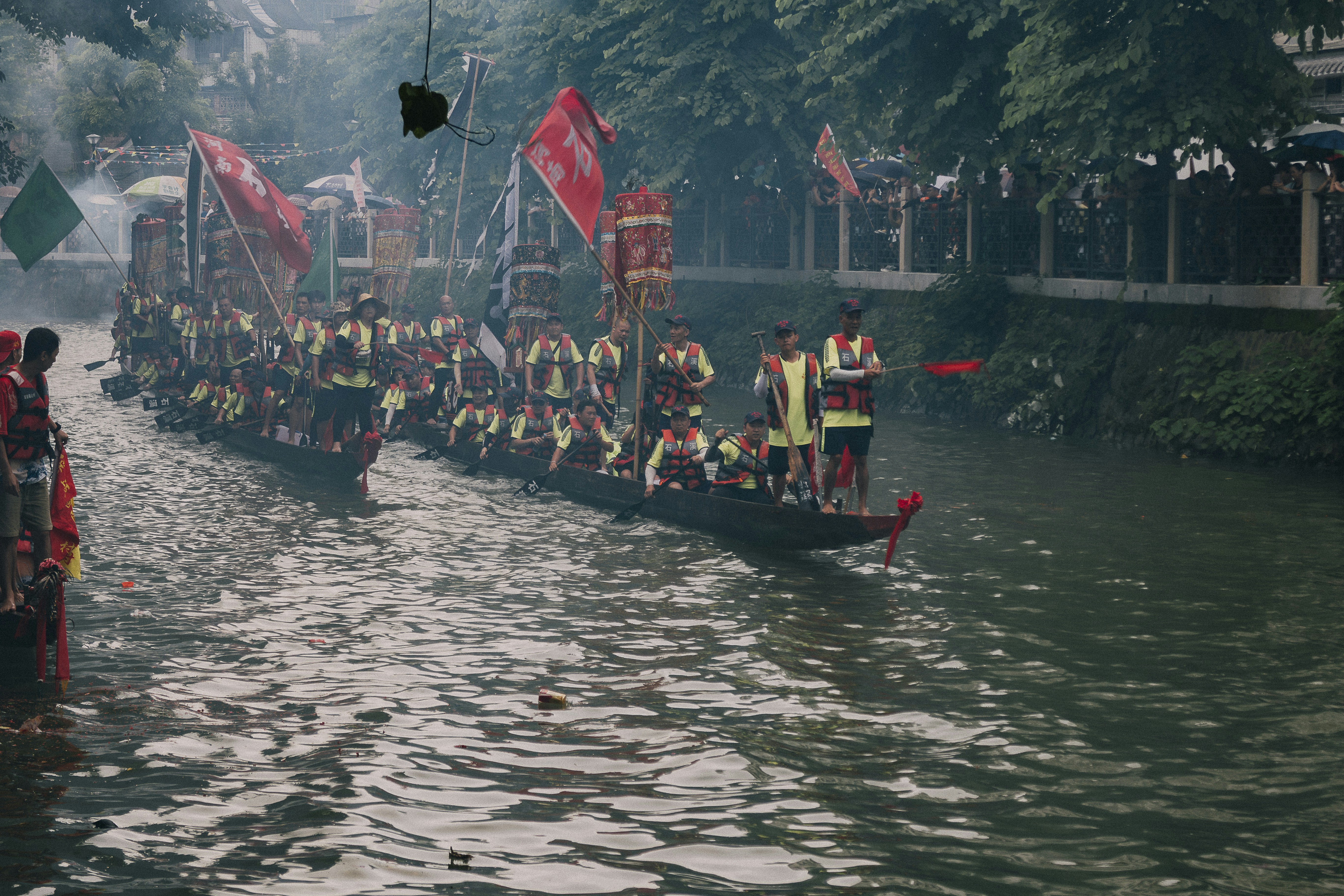 a group of people riding on the back of a boat