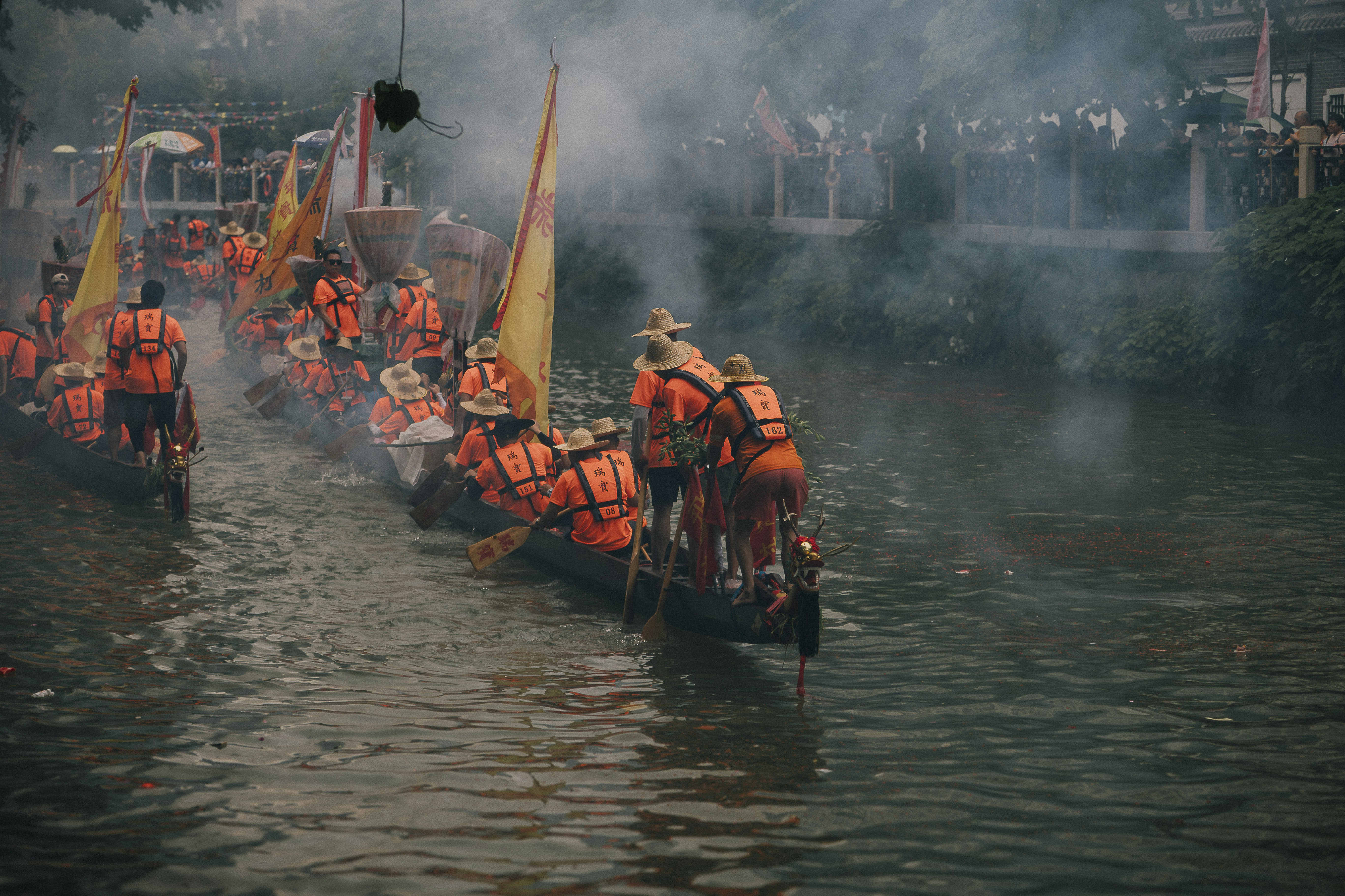 a group of people in life jackets on a boat