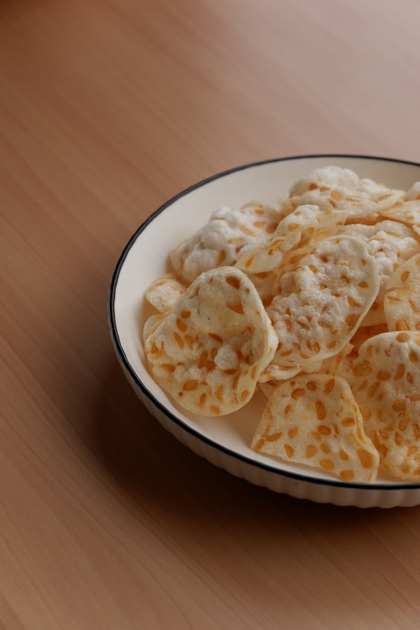 A bowl of crackers on a wooden table