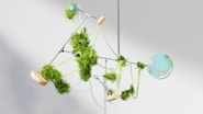 a mobile made of green plants and balls
