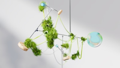 a mobile made of green plants and balls
