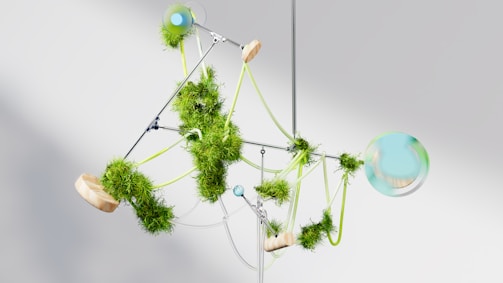 a mobile made of green plants and balls