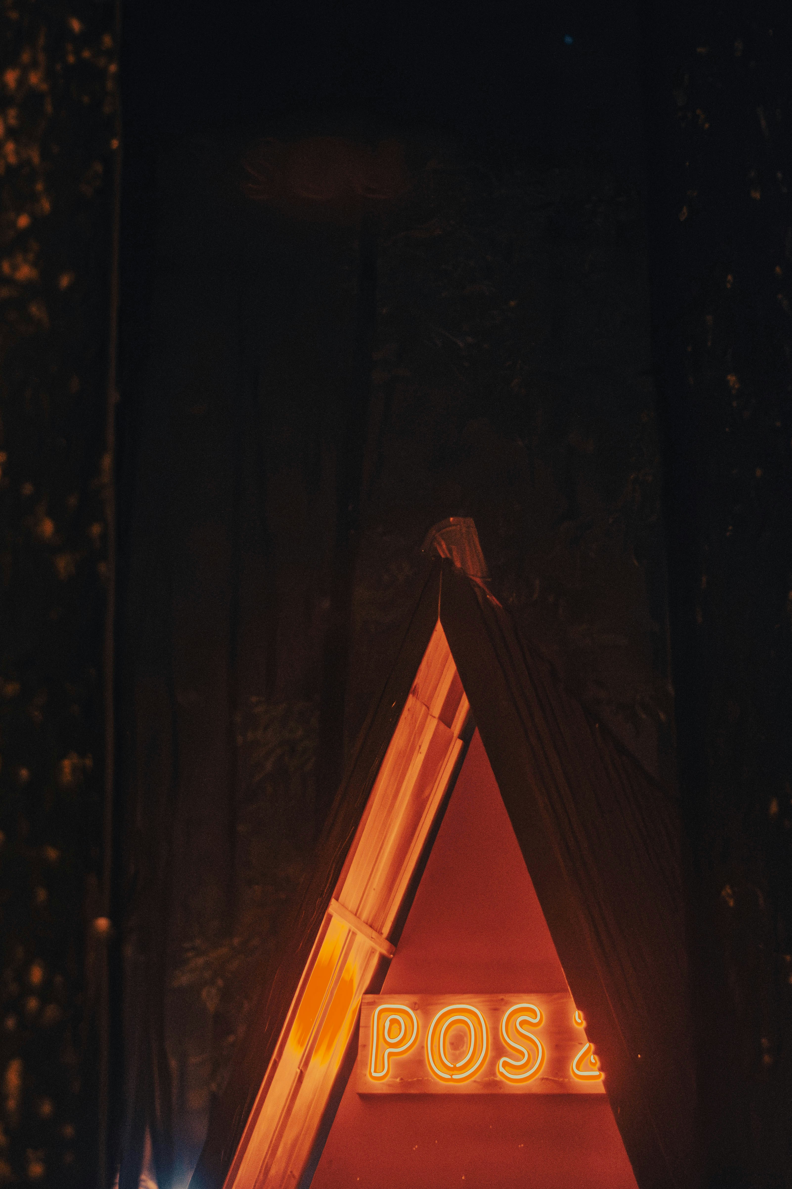 a sign that is lit up in the dark