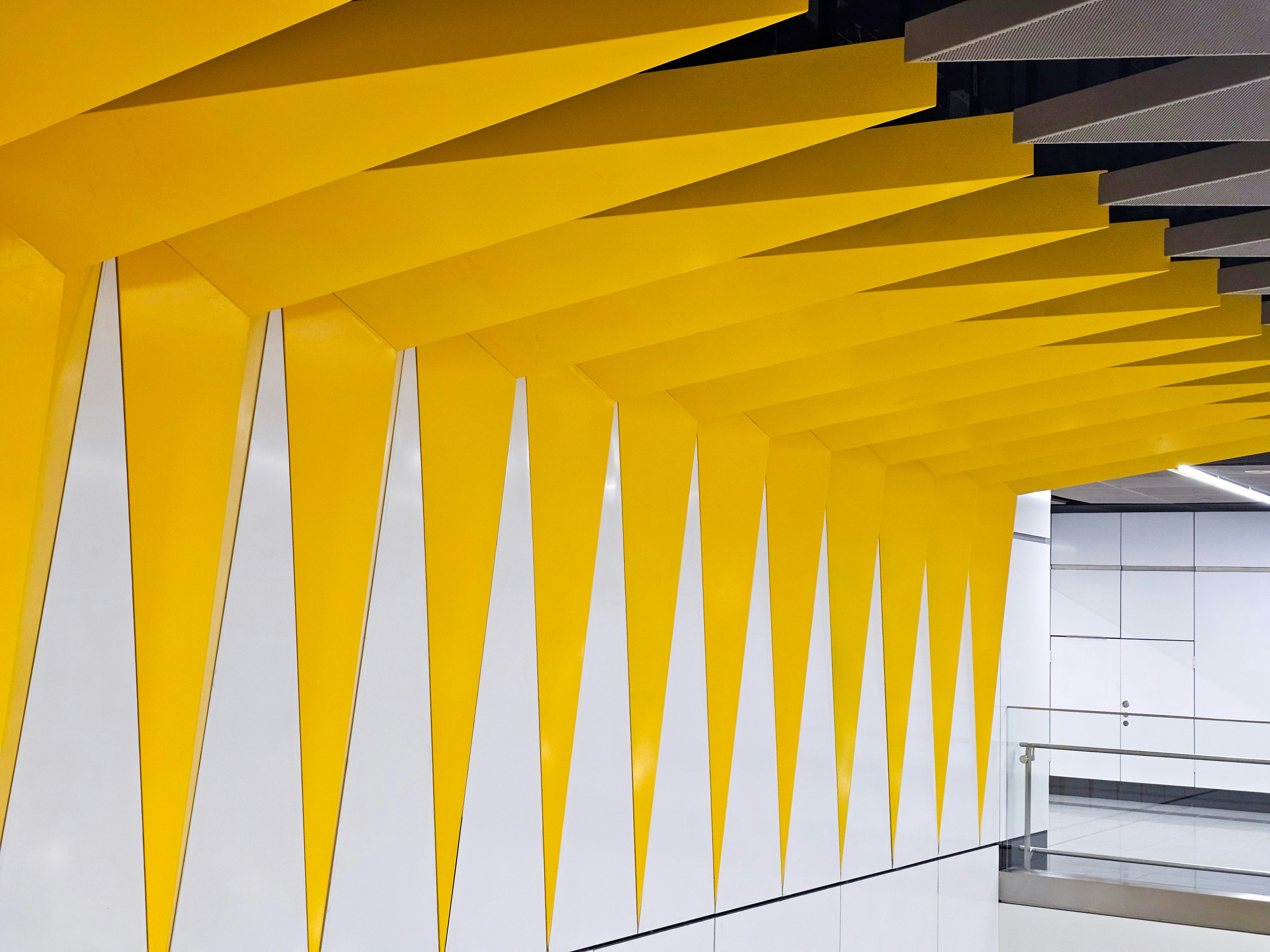 a room with yellow and white walls and a white floor