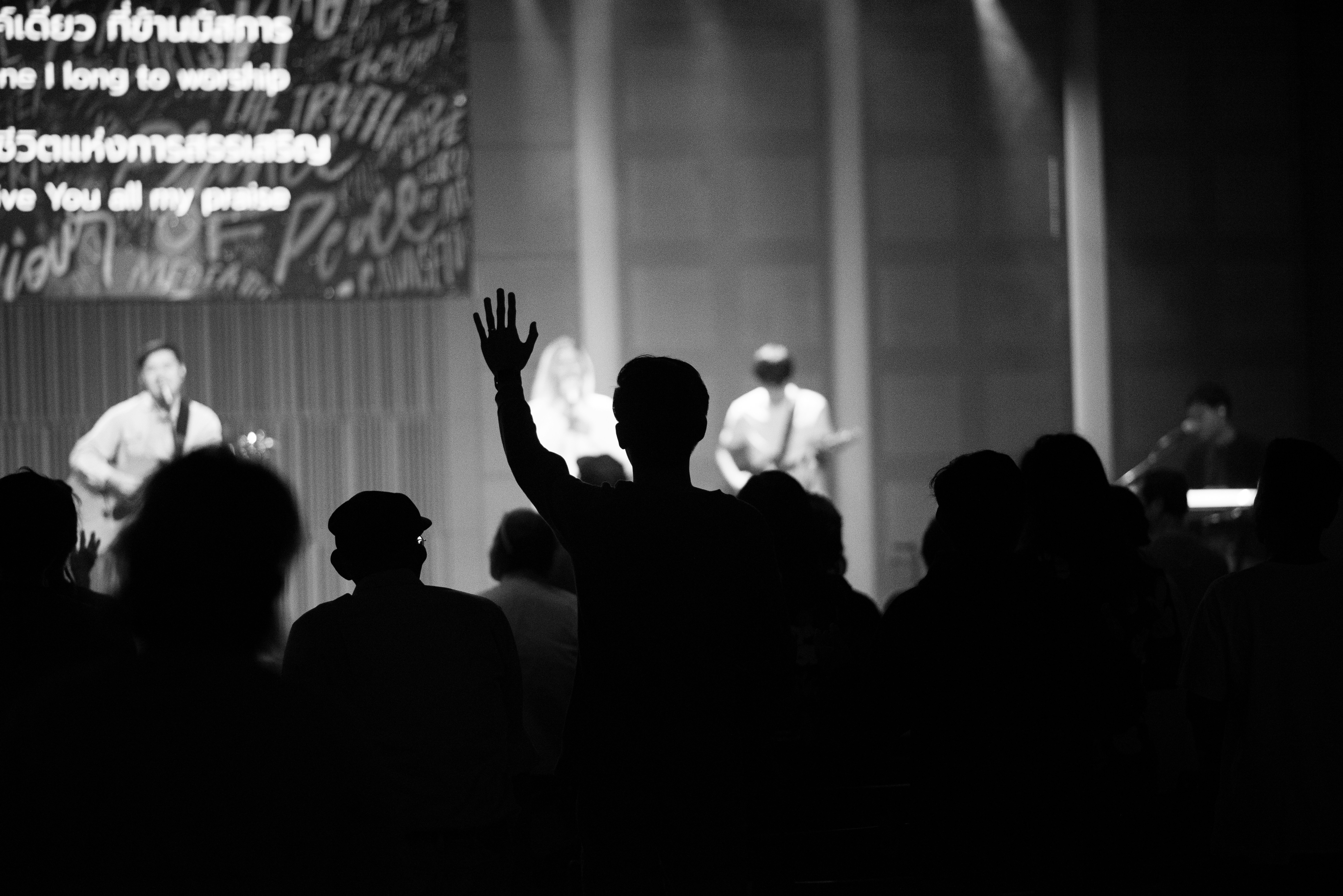a man standing in front of a crowd of people