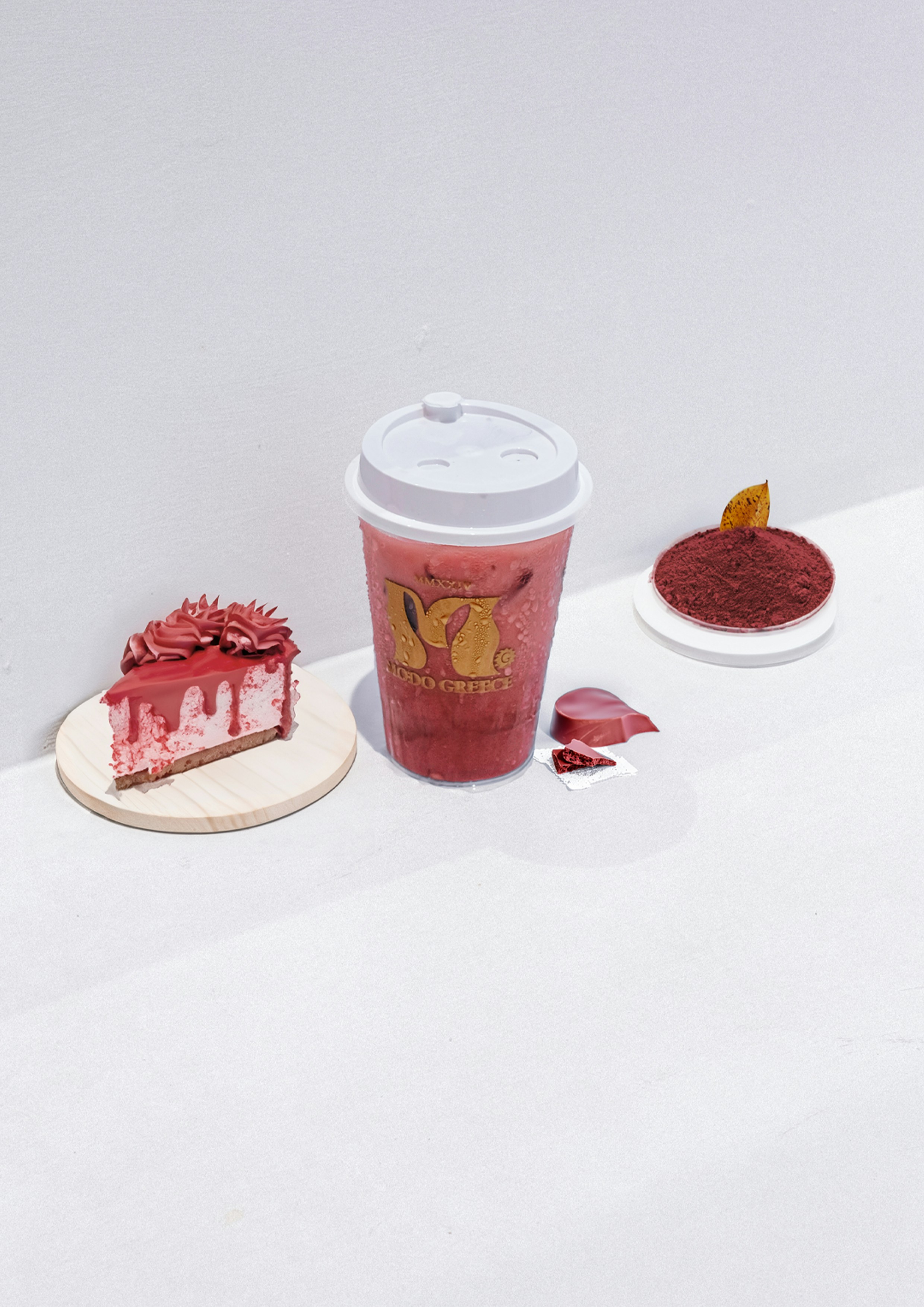 A cup of coffee next to a piece of cake