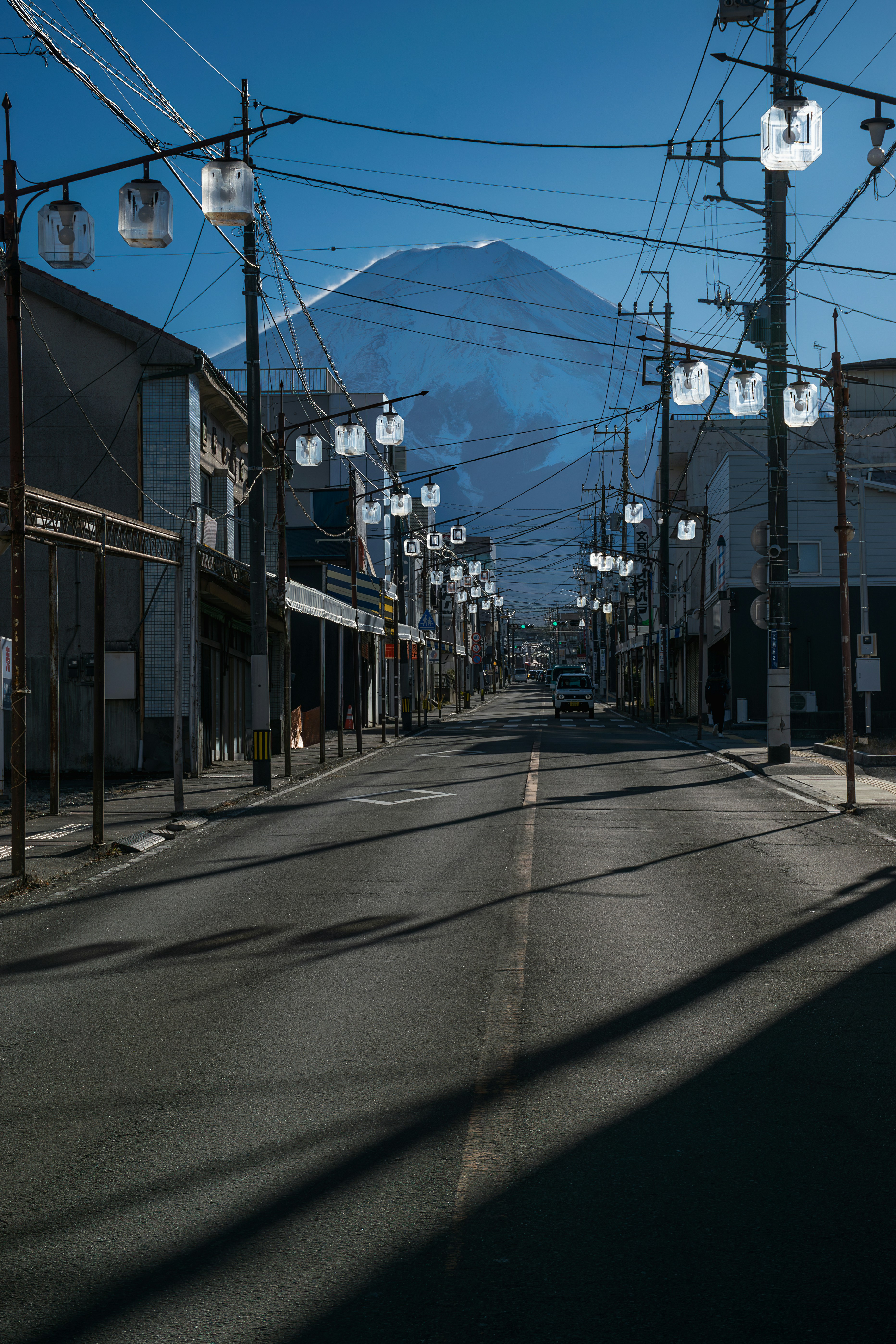 a street with a mountain in the background