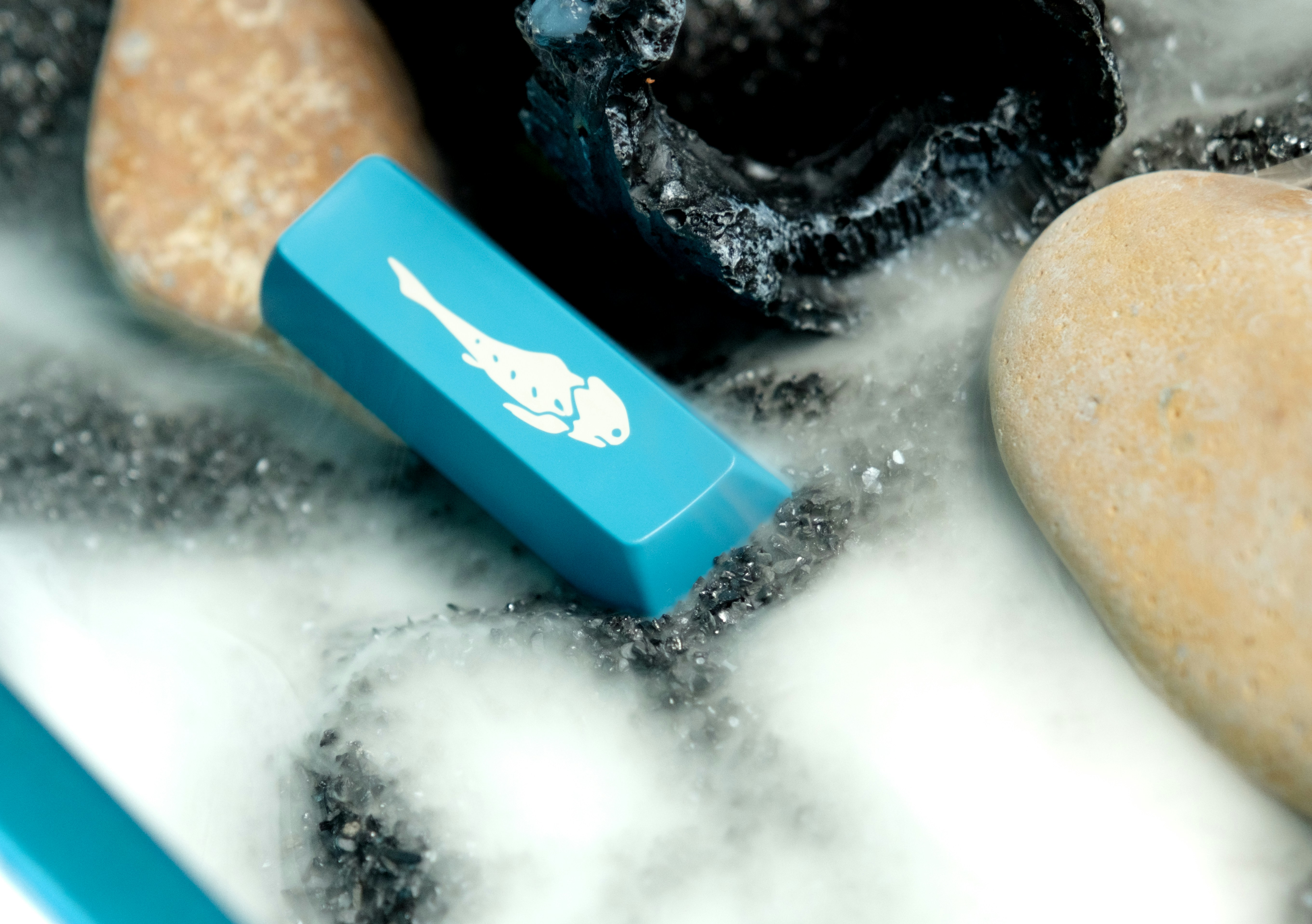 a close up of a toothbrush in a bath of water