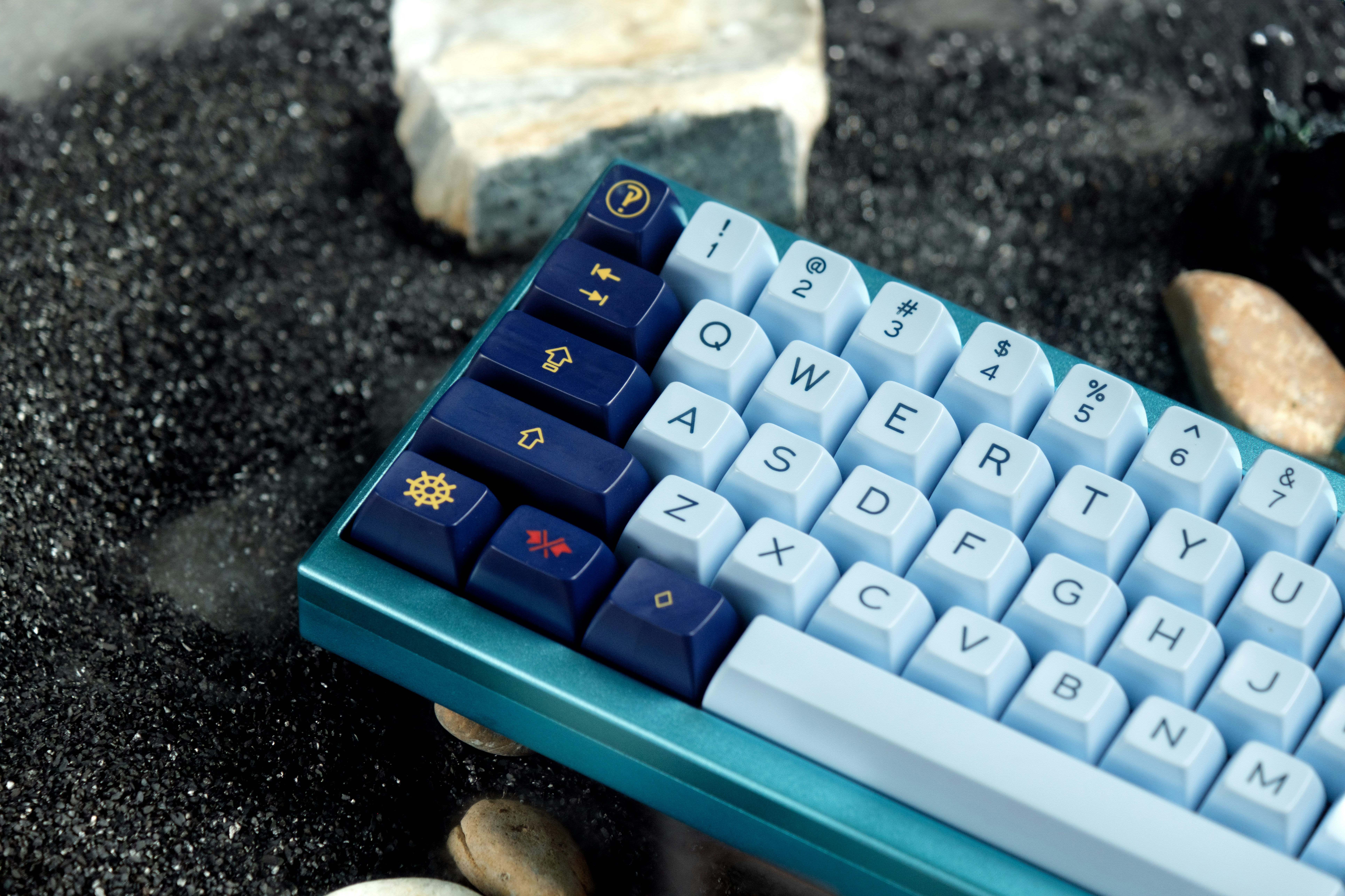 a blue keyboard sitting on top of a black table