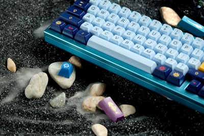 a computer keyboard sitting on top of a table