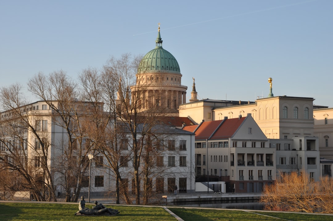 a large building with a green dome on top of it,