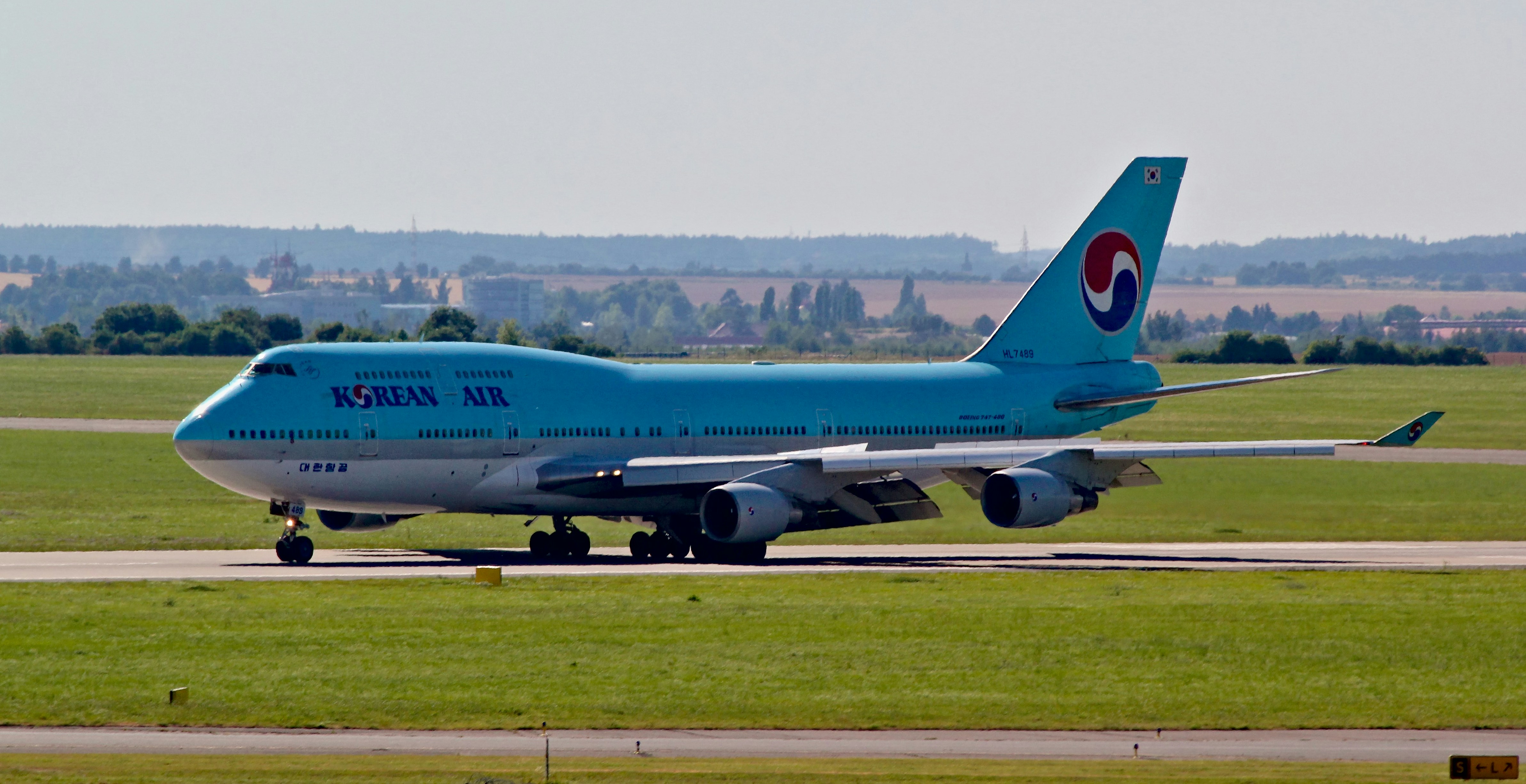 a large jetliner sitting on top of an airport runway