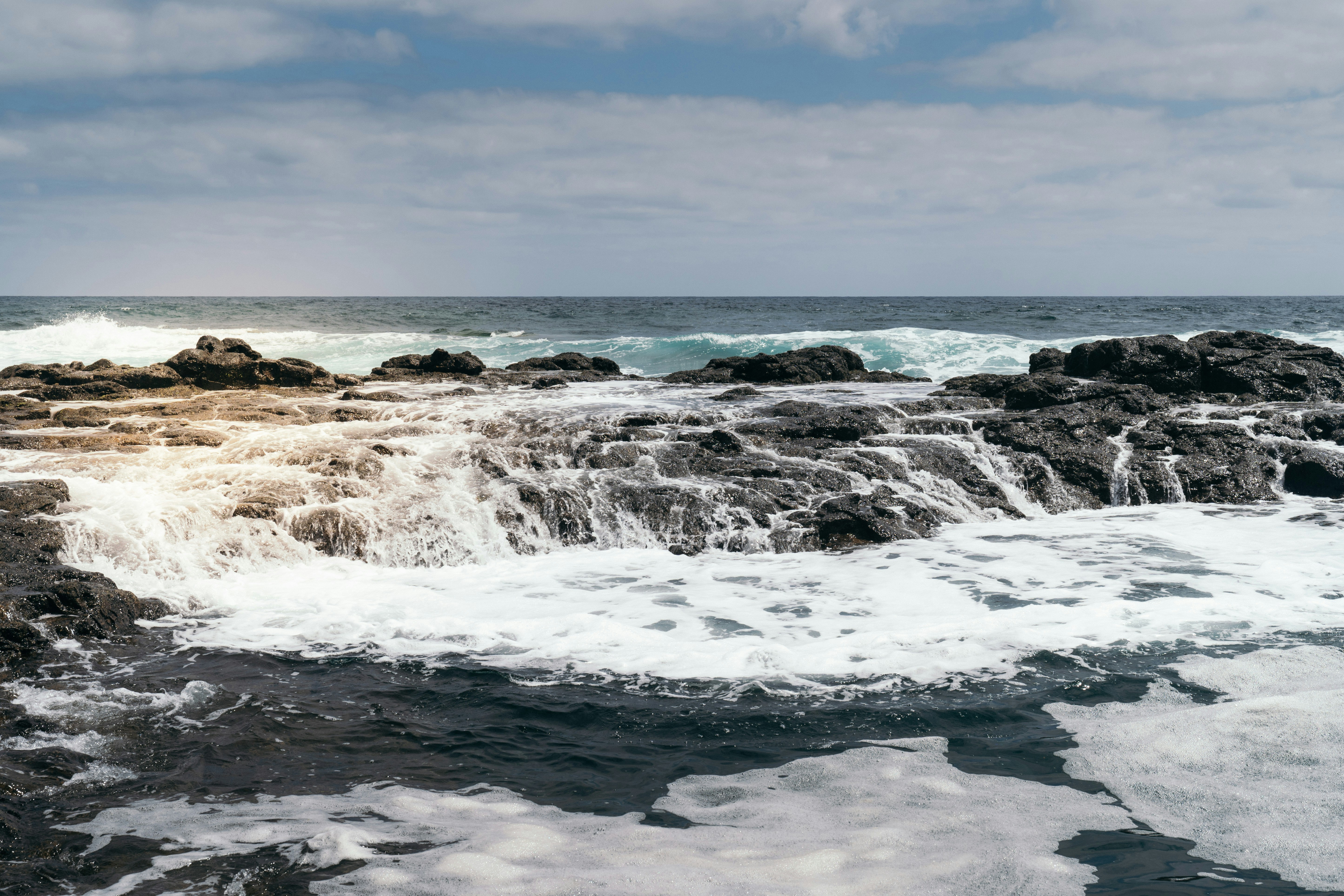 a large body of water surrounded by rocks