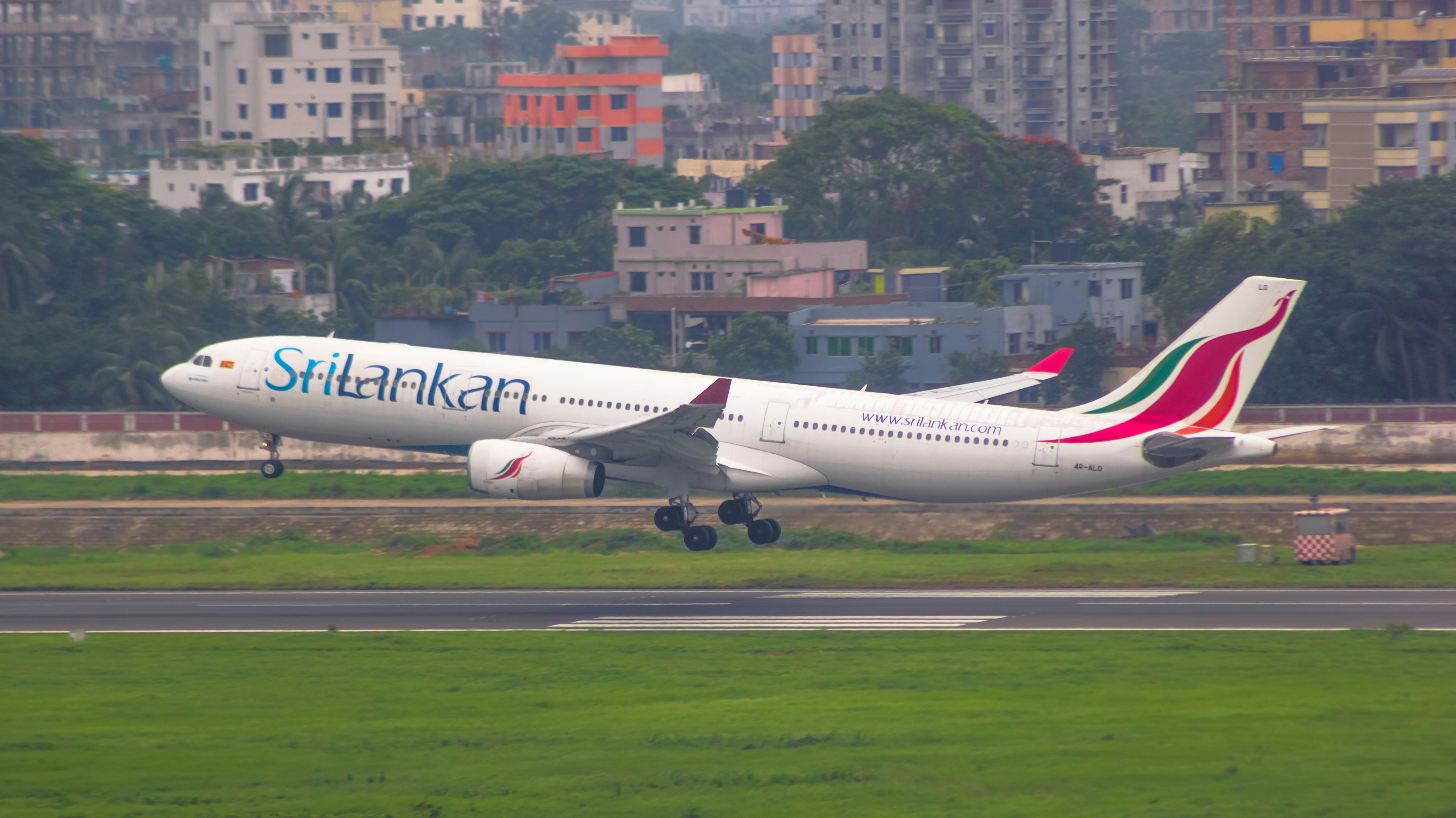 a large jetliner taking off from an airport runway