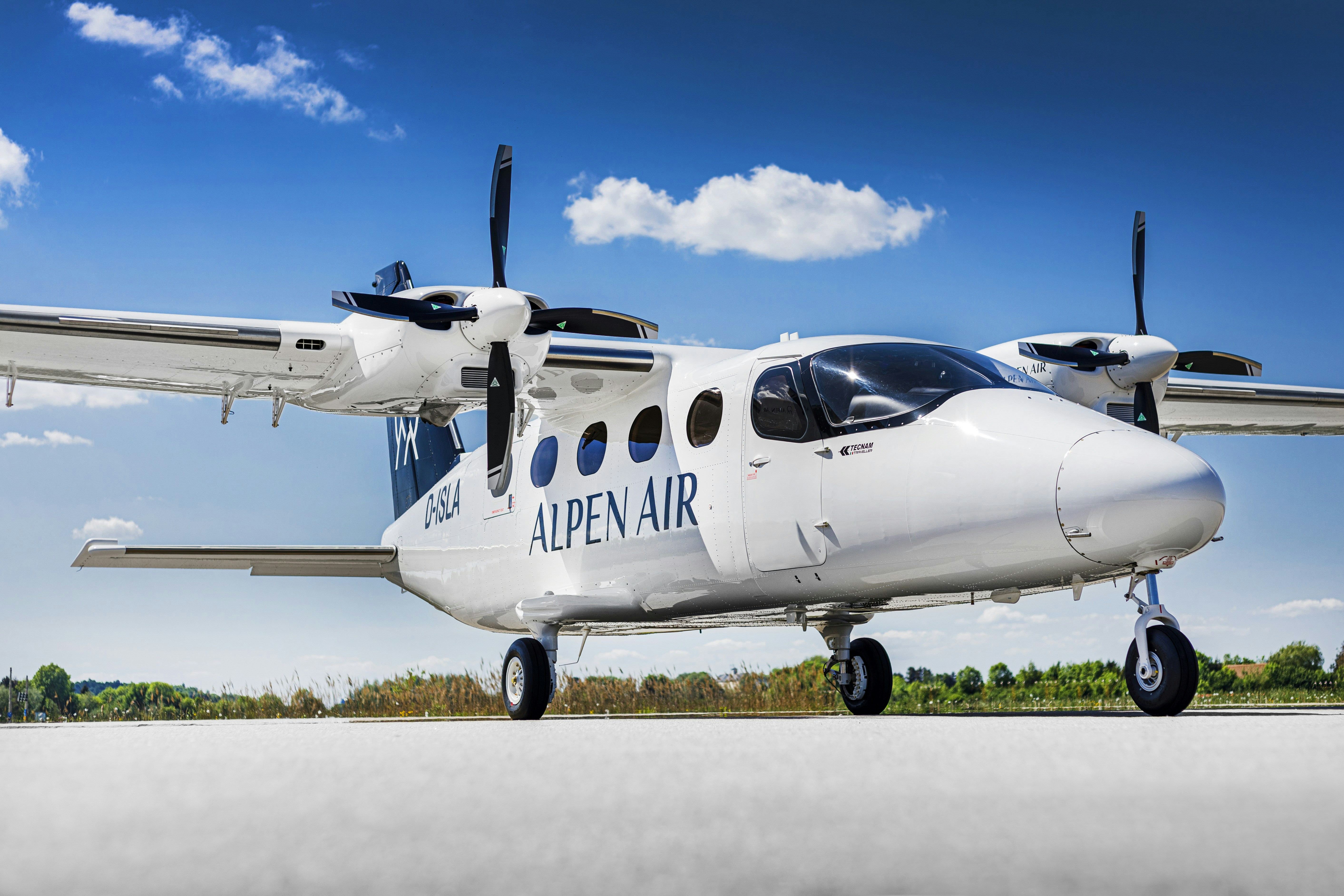 a small airplane sitting on top of an airport tarmac