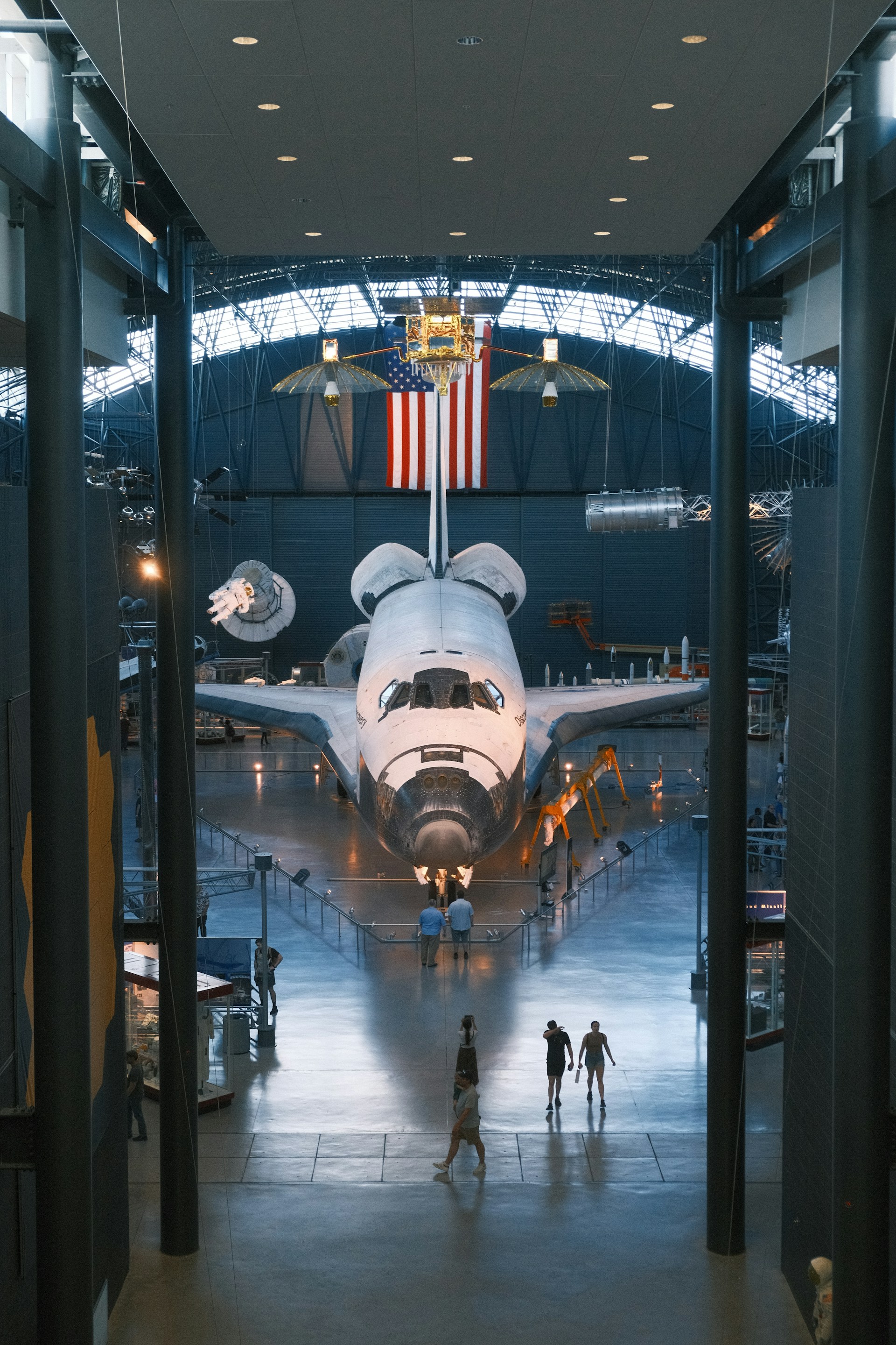 a large space shuttle sitting inside of a hangar