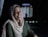 a woman in a headscarf smiles at the camera