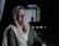 a woman in a headscarf smiles at the camera