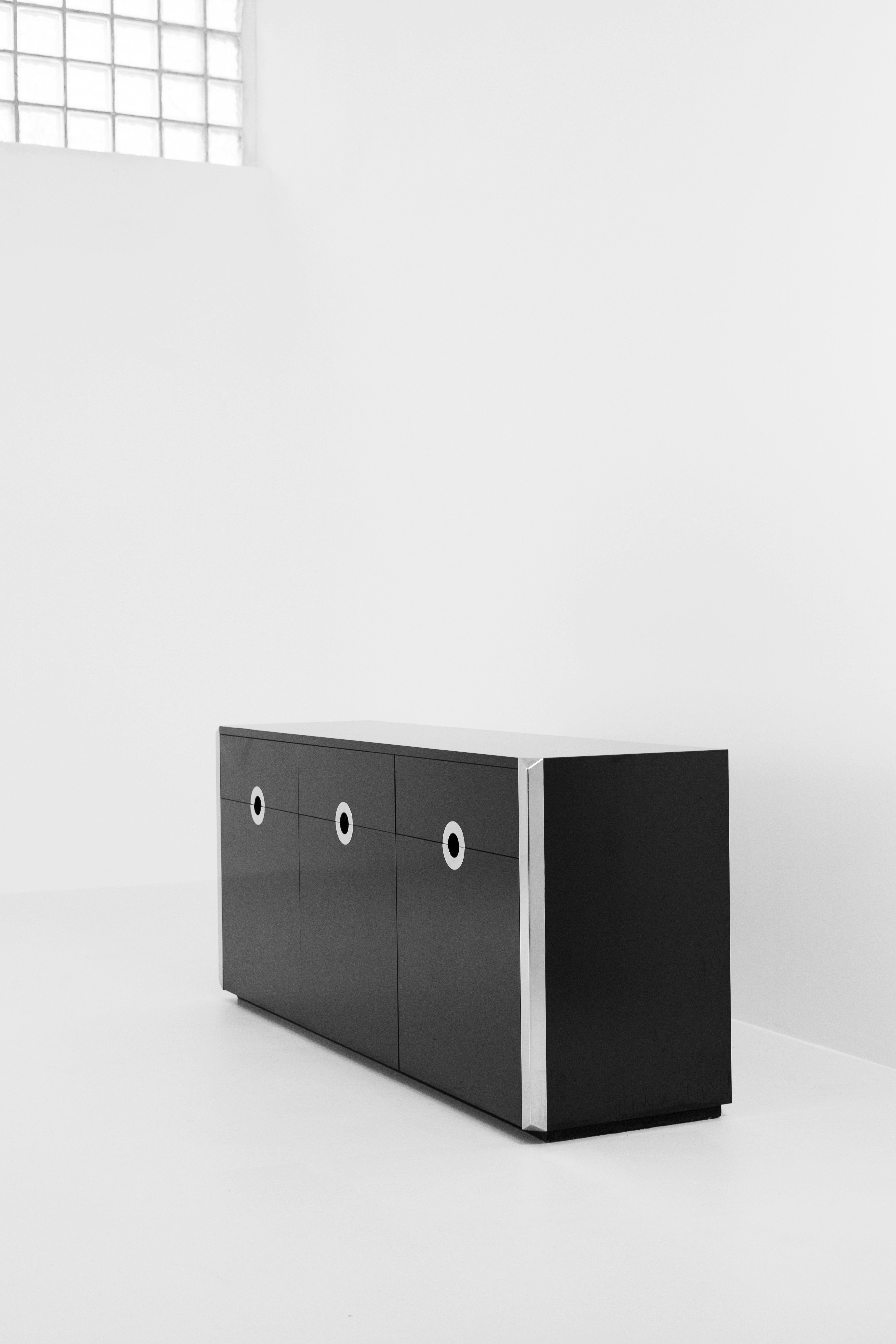 a black cabinet with two doors and two drawers