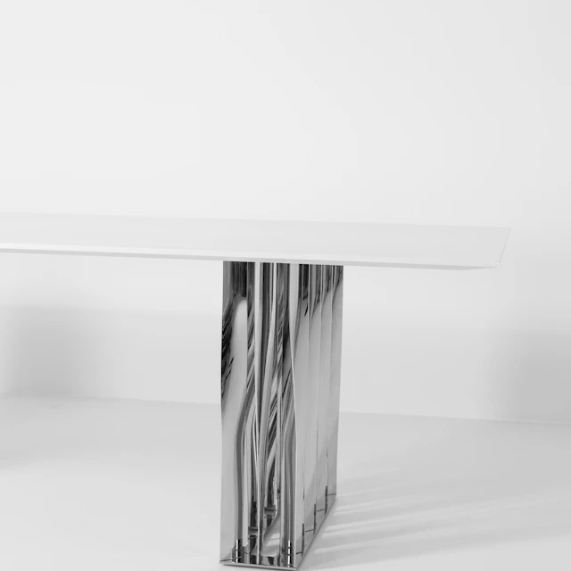 A white table with a black and white graphic design on its surface