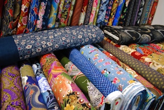 a bunch of different colored ties are on display