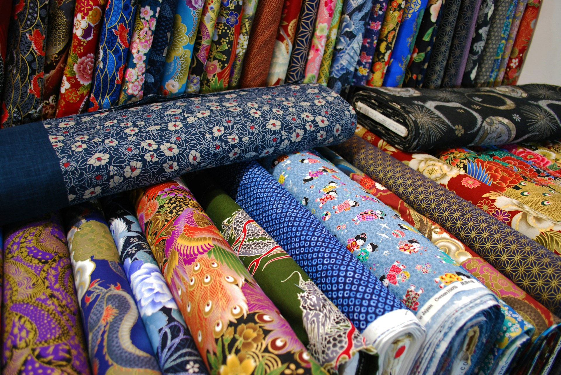 a bunch of different colored ties are on display