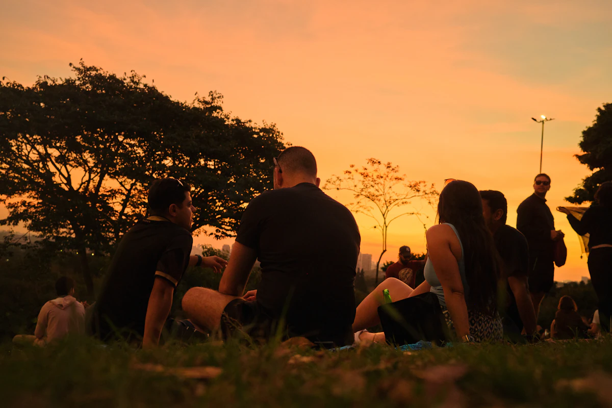 A group of people sitting together enjoying a scenic view
