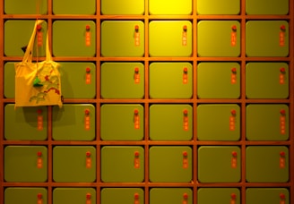 a yellow bag is hanging on a yellow wall