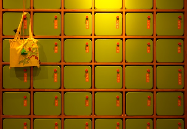 a yellow bag is hanging on a yellow wall