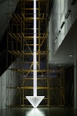 a tall white object with scaffolding around it