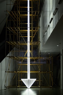 a tall white object with scaffolding around it