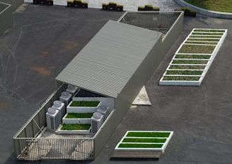 an aerial view of a building with green roof