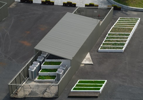 an aerial view of a building with green roof